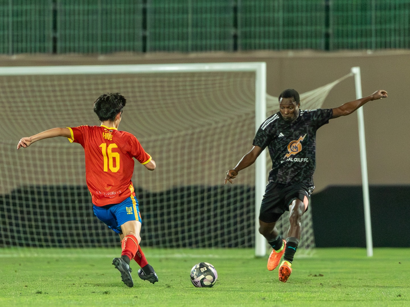 Fursan Hispania FC player driving forward with the ball